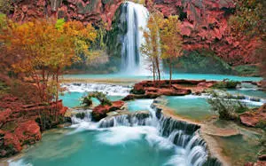 Enjoying the Sights and Sounds of a peaceful Autumn Waterfall