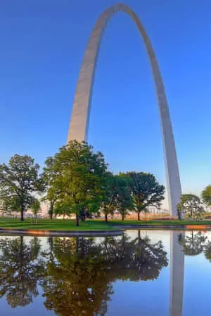 "The Majestic Gateway Arch Towering Over the Mississippi River"