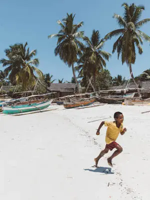 Kids Playing By Madadascar Beach