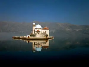  Caption: Majestic Reflection of Our Lady of The Rocks Islet 