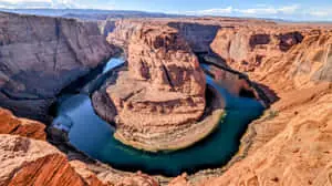 A beautiful river winding through the rugged terrain of nature
