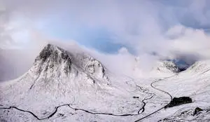 Snowy_ Mountain_ Peak_with_ Winding_ Road