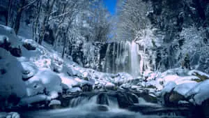 "Majestic cascades of water falling over a rocky ravine, surrounded by lush vegetation" 